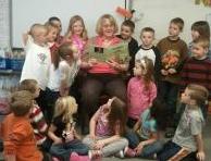 Ann Morris Reading to a Group of Kids